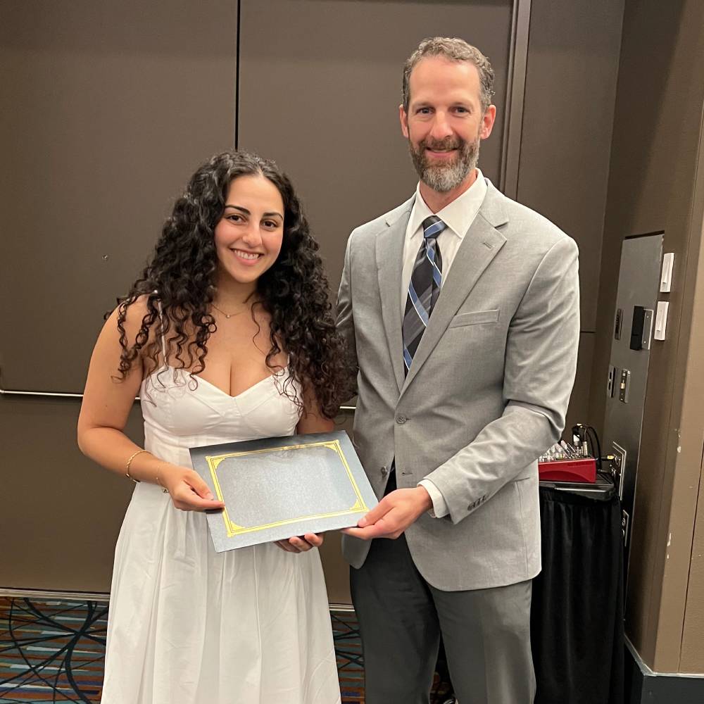 Deema Ballout received the Susanne Hirt Leadership Award, pictured with Ben Darter, chair