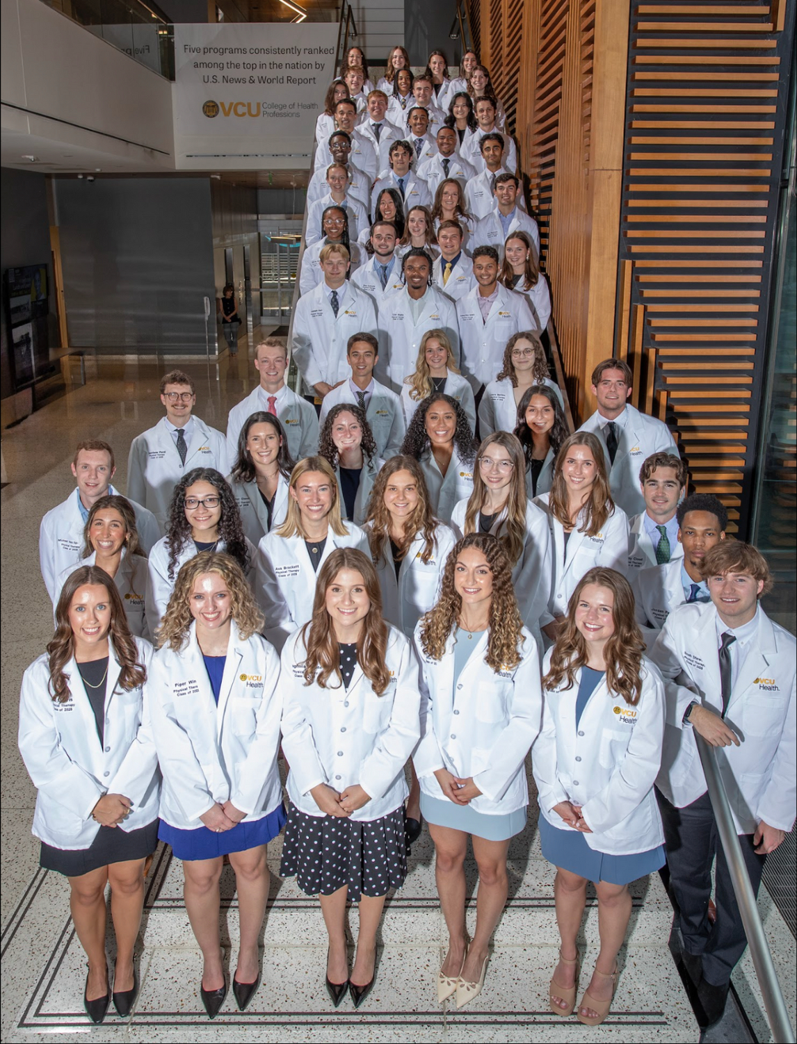 Physical Therapy White Coat students standing on CHP staircase