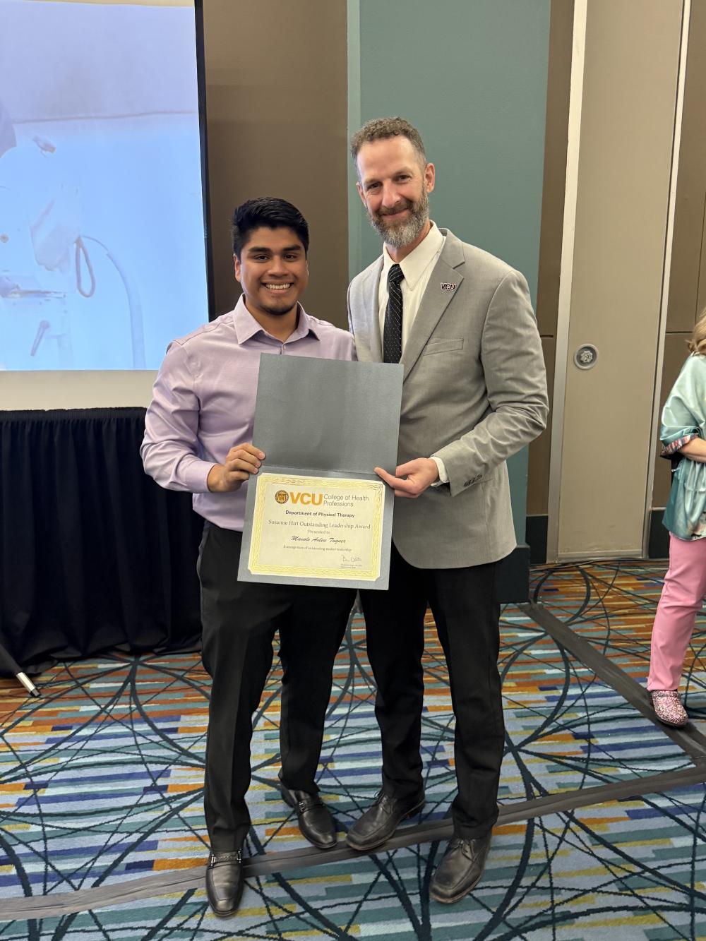 Manolo Anleu Tuquer presented with the Sue Hirt Leadership Award by Dean Ben Darter