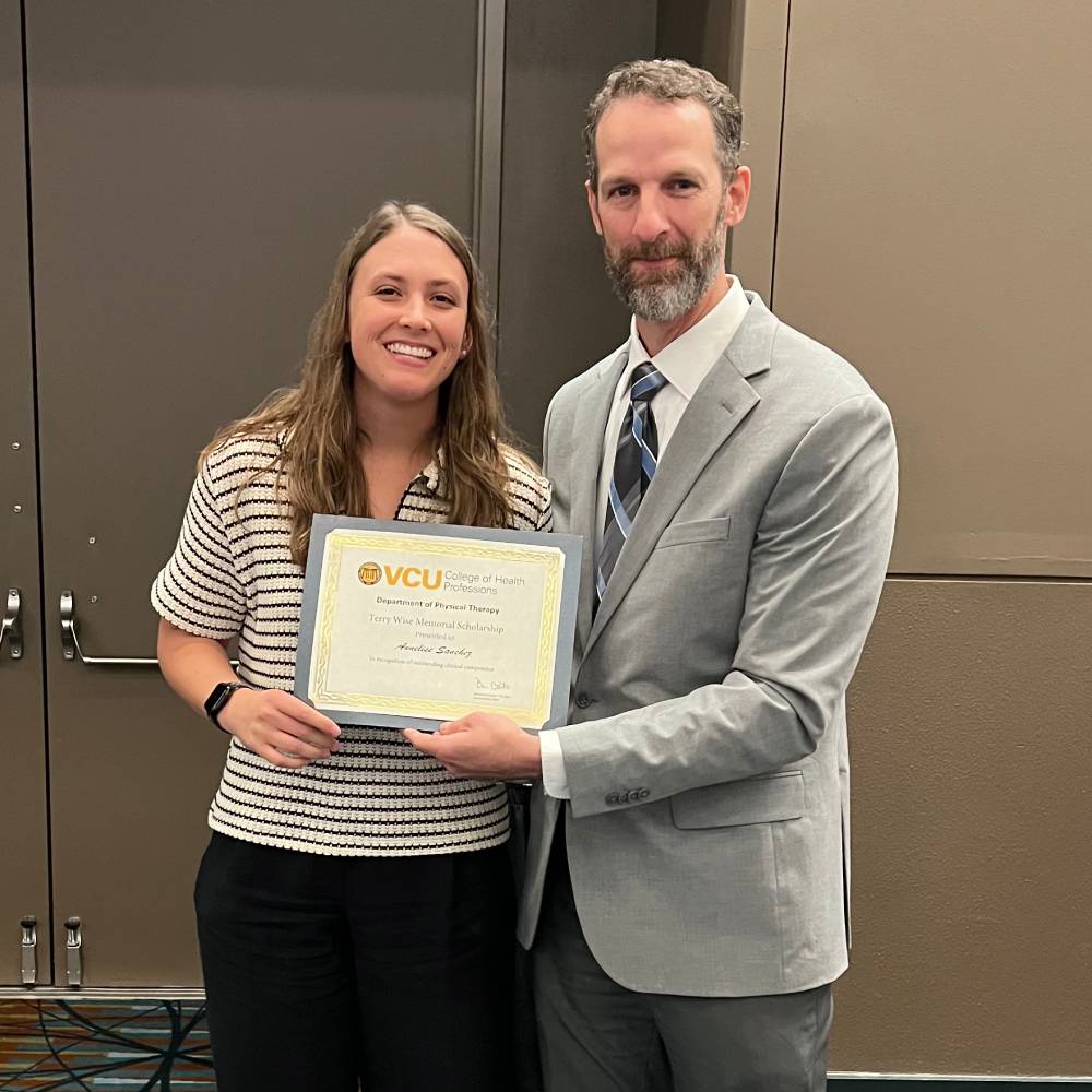 Annelise Sanchez received the Terry Wise Memorial Scholarship, pictured with Ben Darter, chair